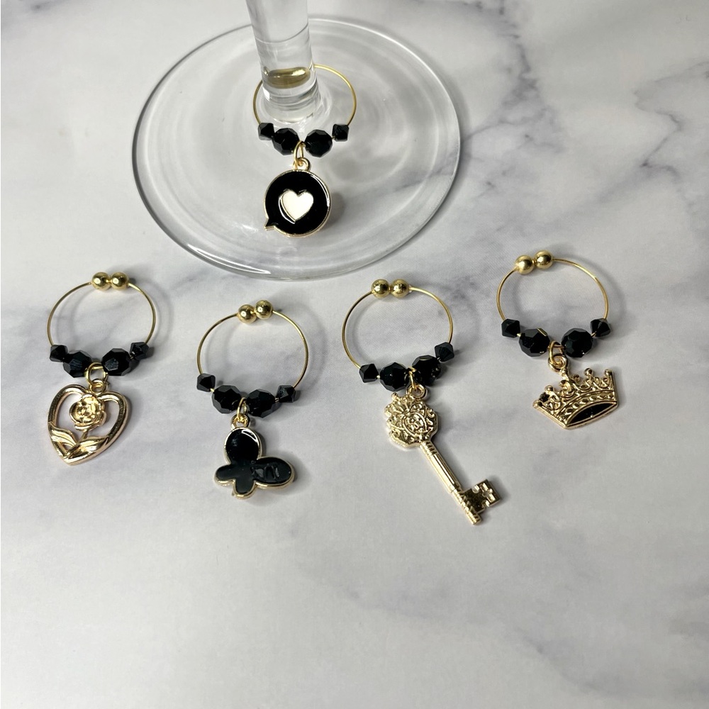 Black and gold wine charms